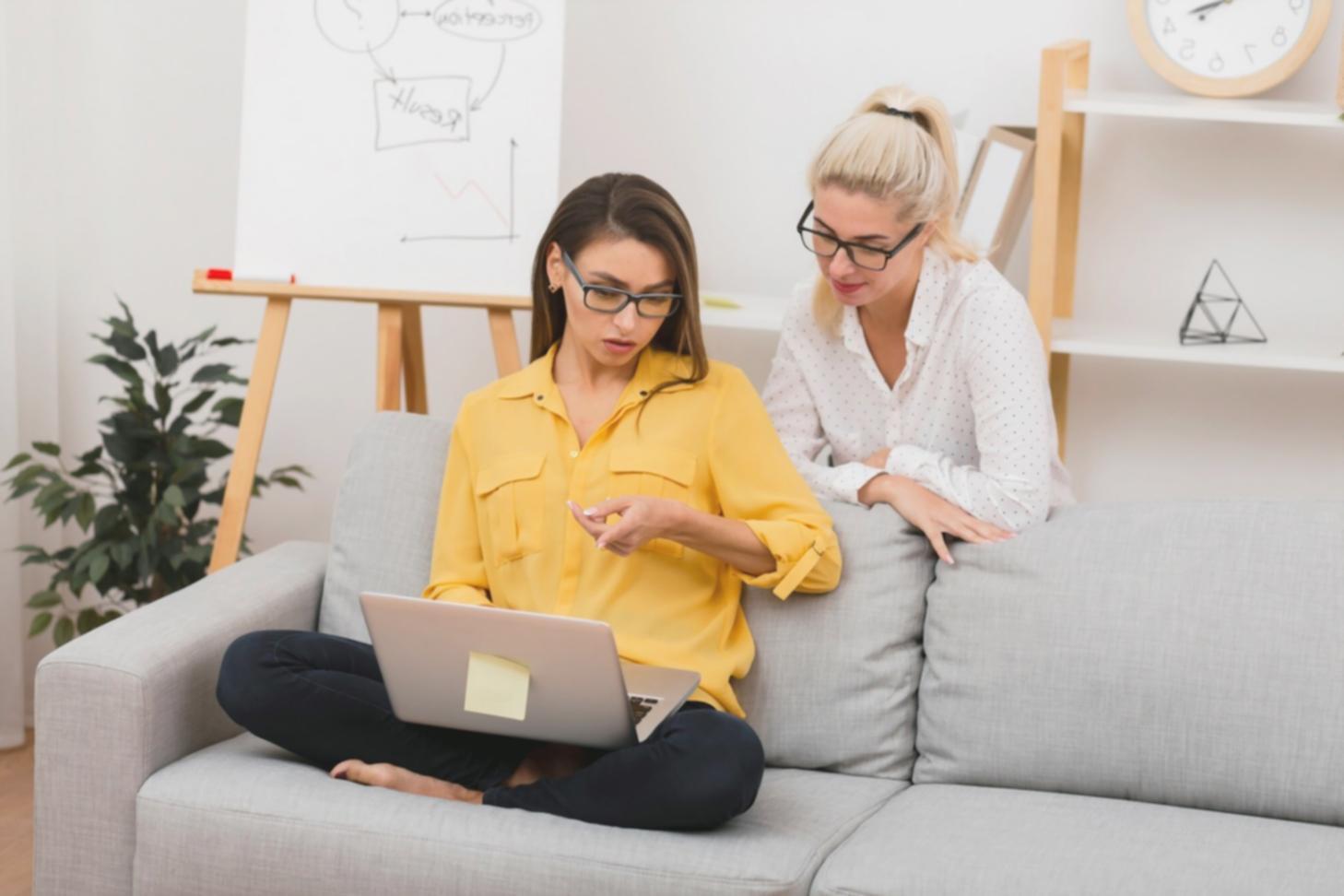 Professional analyzing financial data and charts on multiple monitors